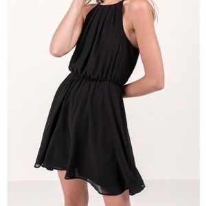 Francesca’s black sleeveless dress